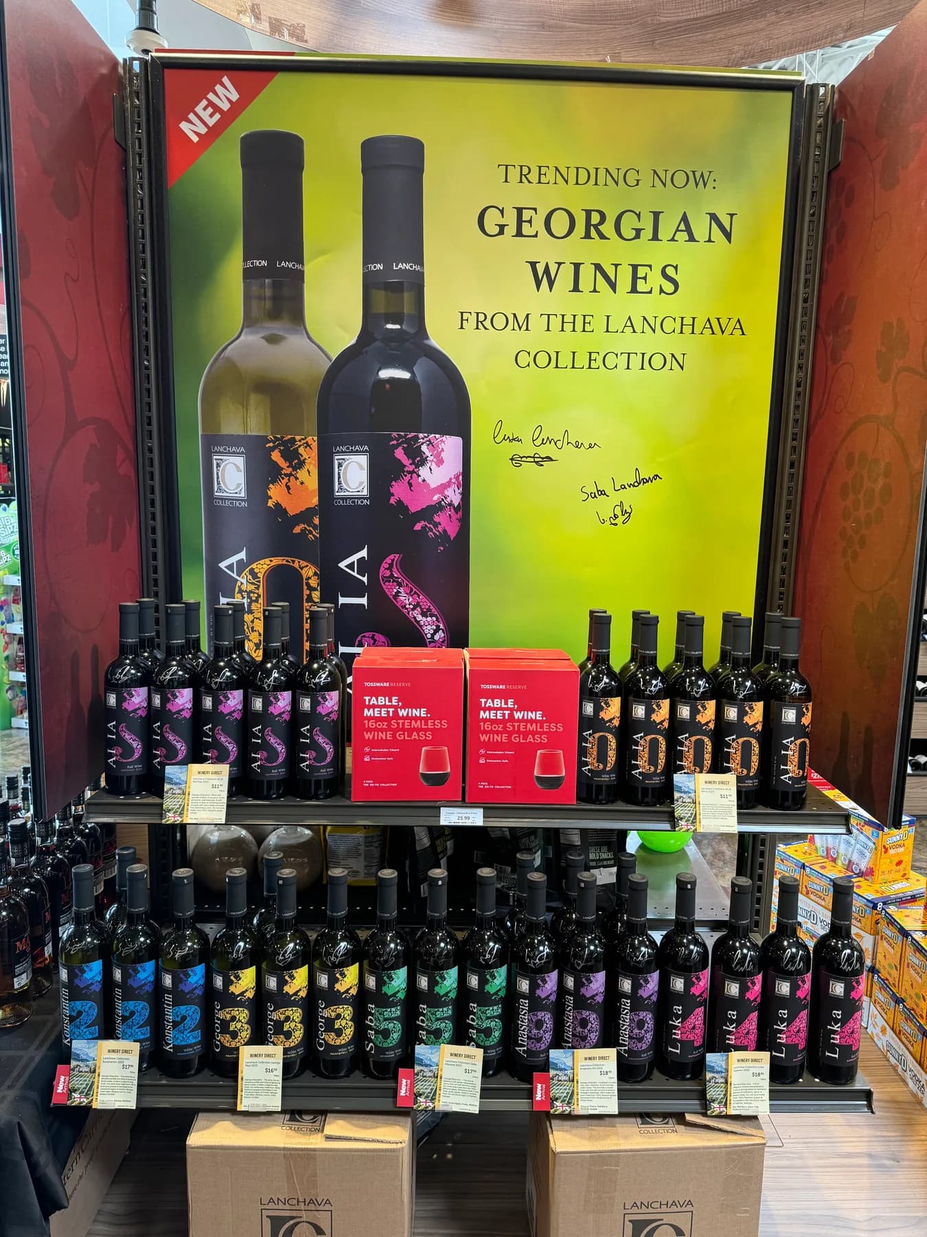 A store display reading Trending Now: Georgian Wines from the Lanchava Collection, above shelves of bottles and cases